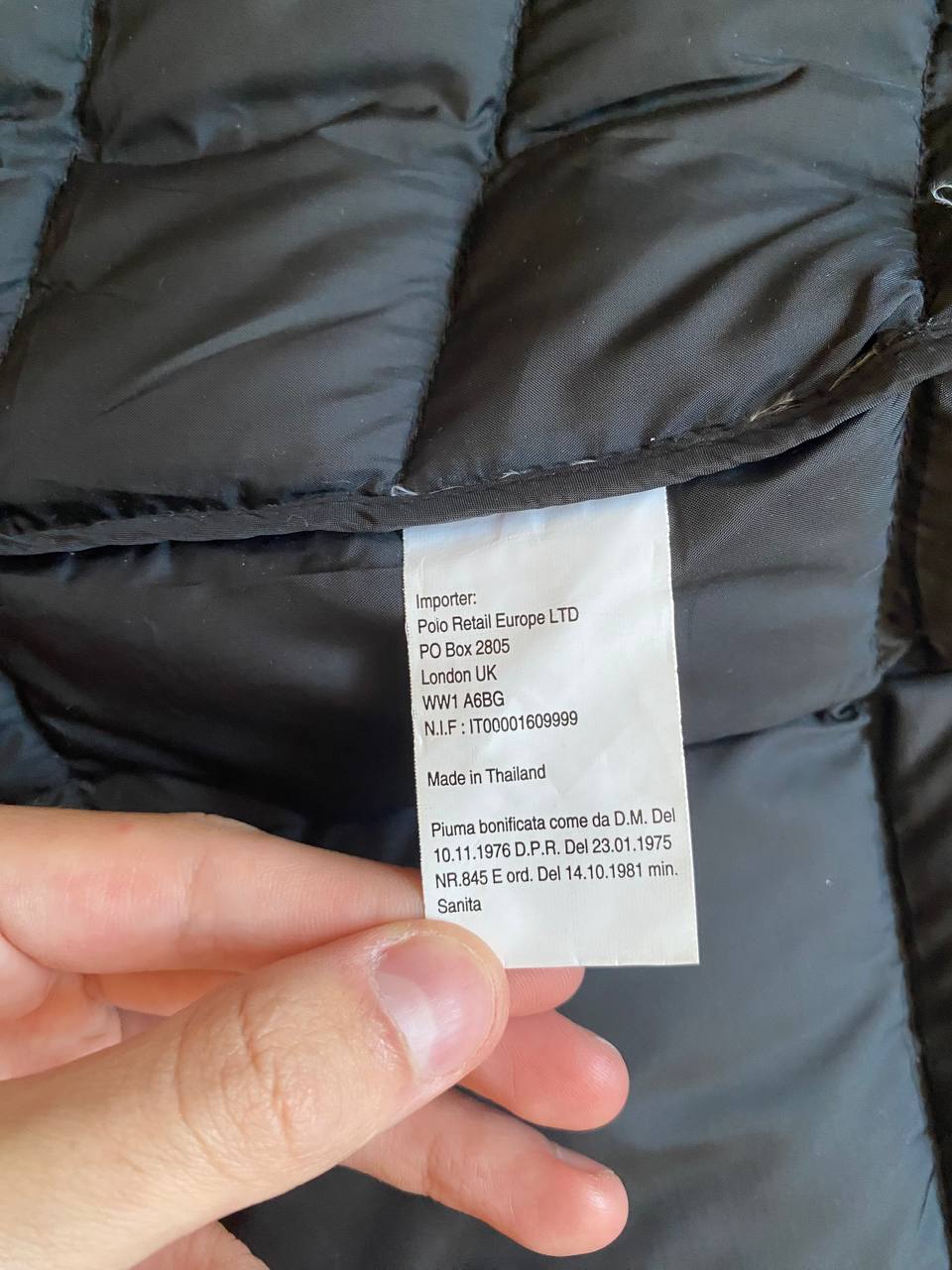 Ralph Lauren black puffer gilet vest with brown zippered pockets and ribbed neck.