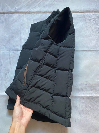 Ralph Lauren black puffer gilet vest with brown zippered pockets and ribbed neck.