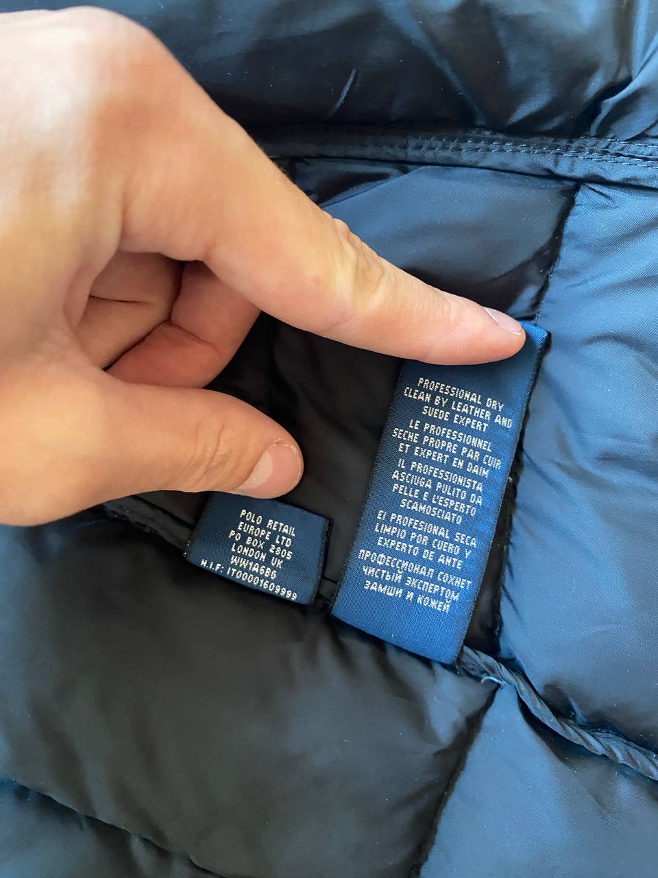 Ralph Lauren black puffer gilet vest with brown zippered pockets and ribbed neck.