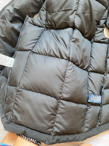 Ralph Lauren black puffer gilet vest with brown zippered pockets and ribbed neck.