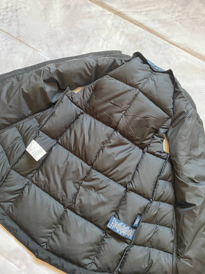 Ralph Lauren black puffer gilet vest with brown zippered pockets and ribbed neck.