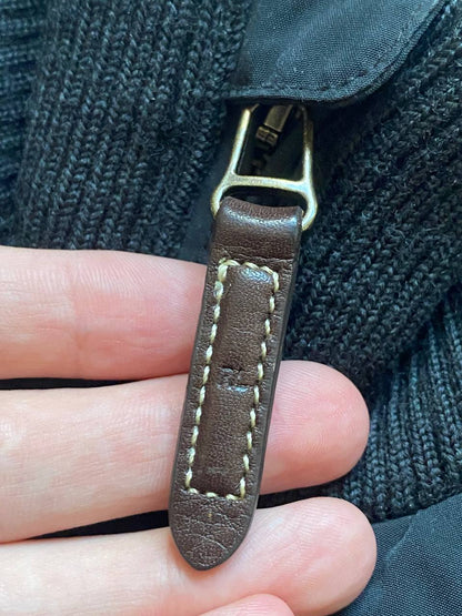 Ralph Lauren black puffer gilet vest with brown zippered pockets and ribbed neck.