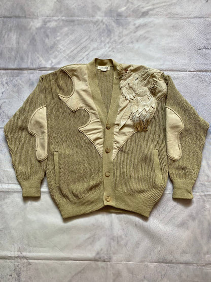 Kansai O2 beige knitted cardigan with embroidered bird detail and fabric patches.