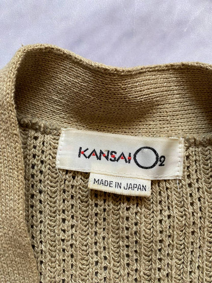 Kansai O2 beige knitted cardigan with embroidered bird detail and fabric patches.