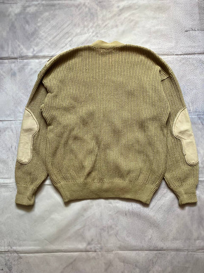 Kansai O2 beige knitted cardigan with embroidered bird detail and fabric patches.