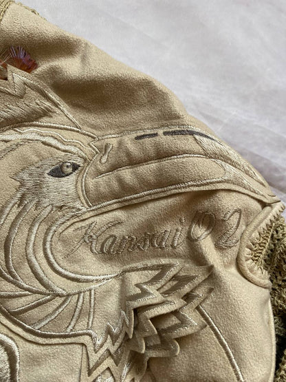 Kansai O2 beige knitted cardigan with embroidered bird detail and fabric patches.