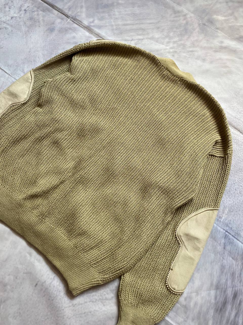 Kansai O2 beige knitted cardigan with embroidered bird detail and fabric patches.