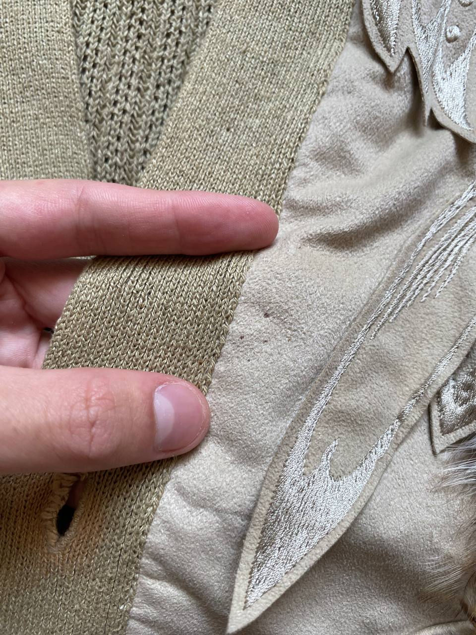 Kansai O2 beige knitted cardigan with embroidered bird detail and fabric patches.