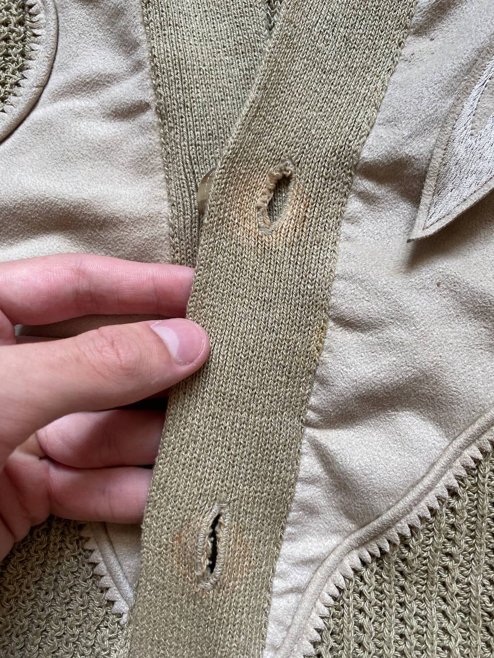 Kansai O2 beige knitted cardigan with embroidered bird detail and fabric patches.
