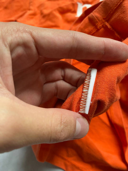 MSGM orange casual t-shirt with white logo print, crew neck, 100% cotton.