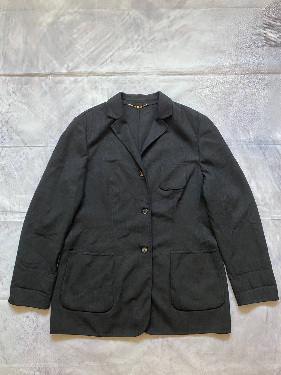 Beams black cotton linen blazer with padded shoulders, three-button front, and slit cuff detail.