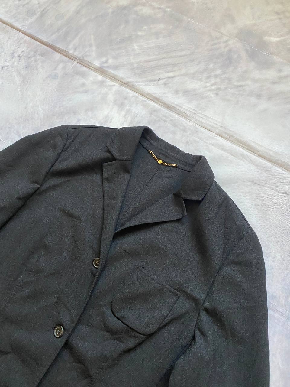 Beams black cotton linen blazer with padded shoulders, three-button front, and slit cuff detail.