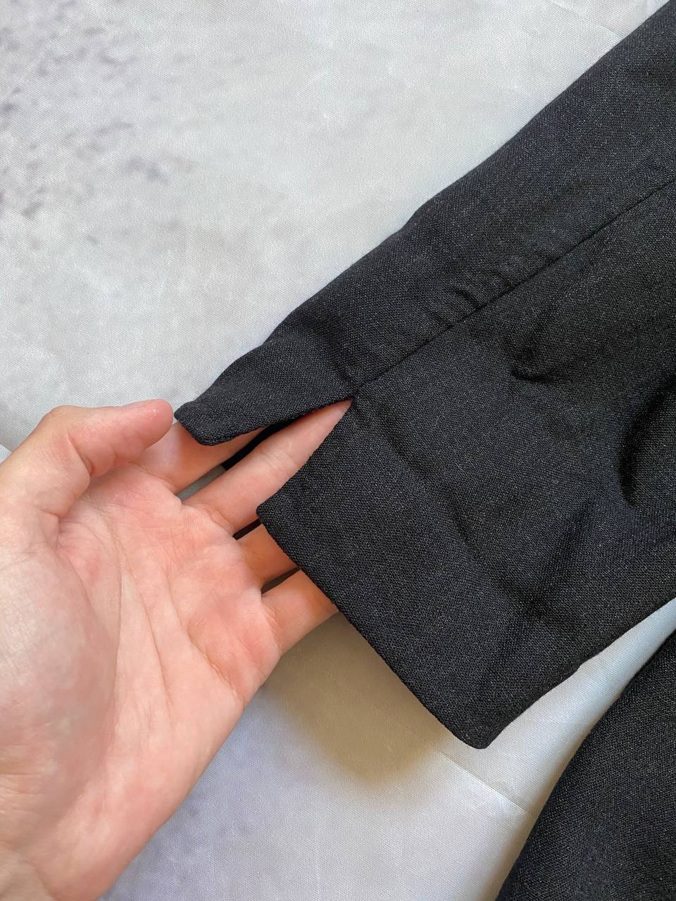 Beams black cotton linen blazer with padded shoulders, three-button front, and slit cuff detail.