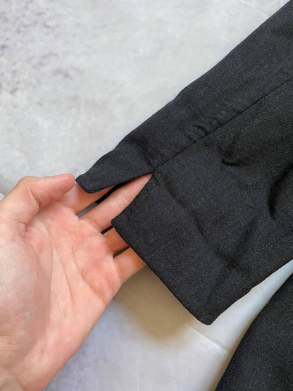 Beams black cotton linen blazer with padded shoulders, three-button front, and slit cuff detail.