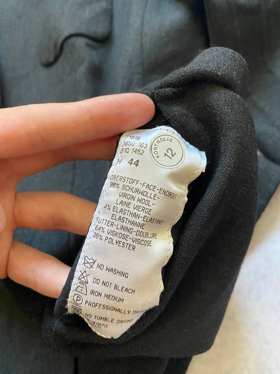 Beams black cotton linen blazer with padded shoulders, three-button front, and slit cuff detail.