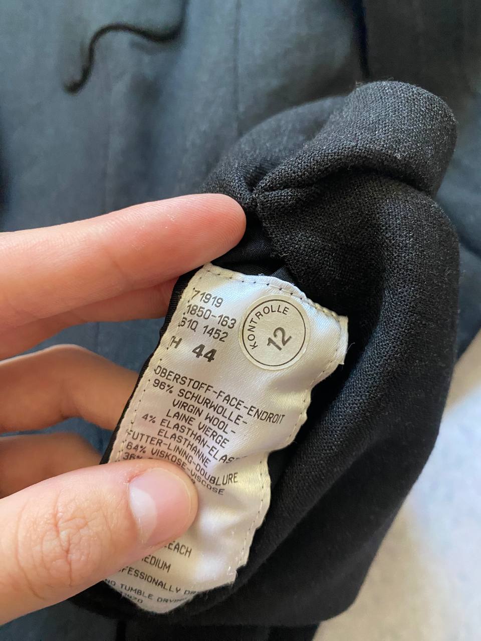 Beams black cotton linen blazer with padded shoulders, three-button front, and slit cuff detail.