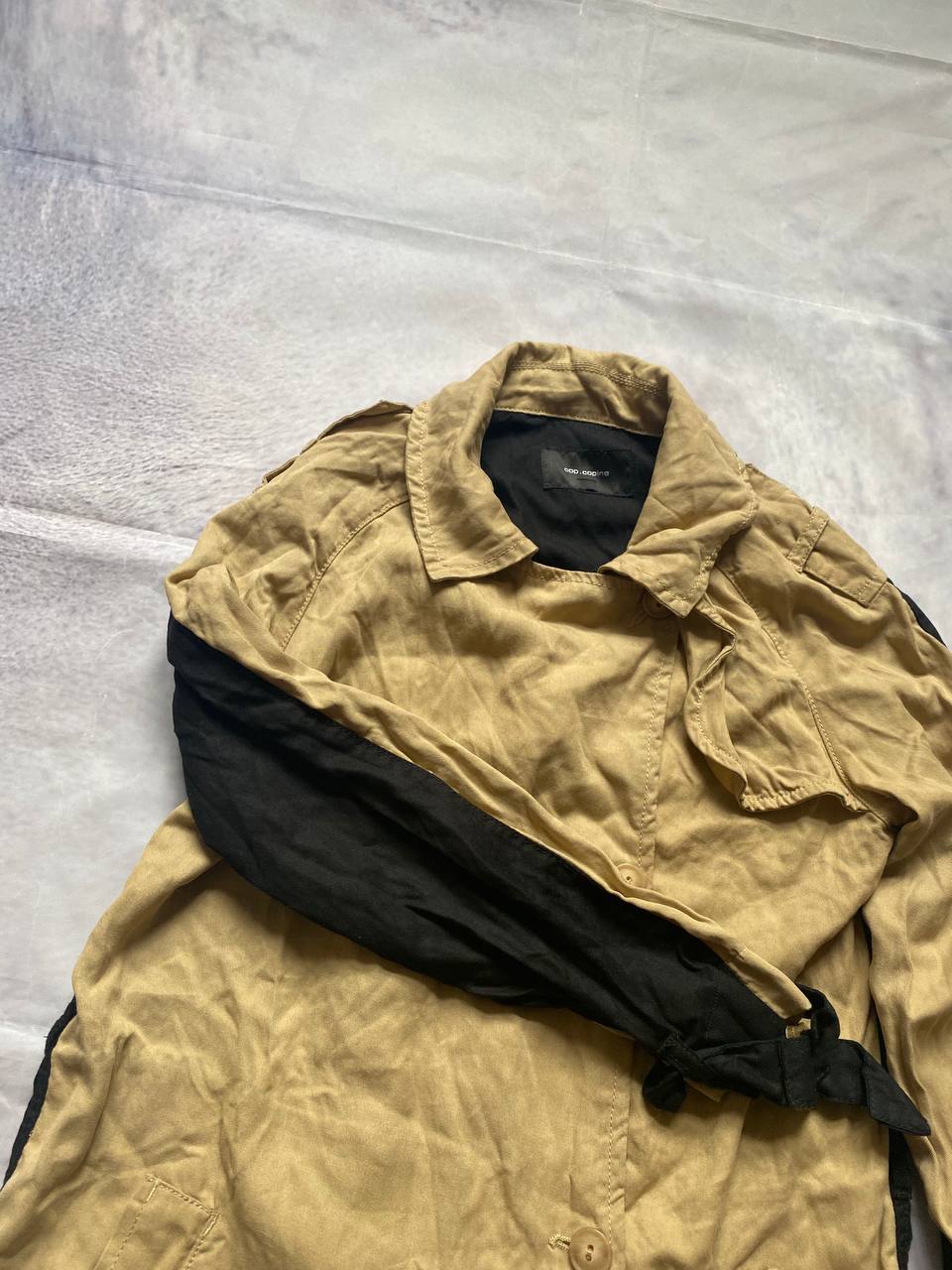 Cop.Copine beige and black trench coat, 100% Lyocell, button closures, adjustable sleeve straps.