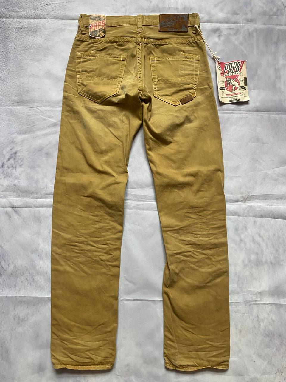 Prps brown cotton trousers with leather logo label and classic 5-pocket styling.