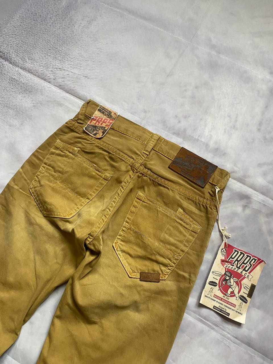 Prps brown cotton trousers with leather logo label and classic 5-pocket styling.