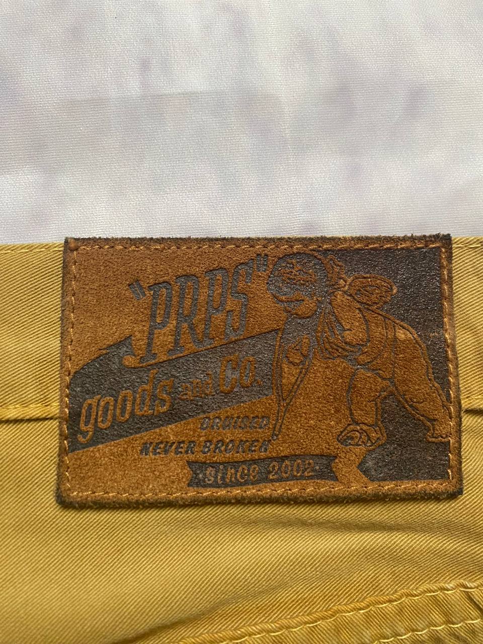 Prps brown cotton trousers with leather logo label and classic 5-pocket styling.