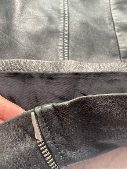 All Saints black quilted leather biker jacket with zippered pockets and adjustable cuffs.