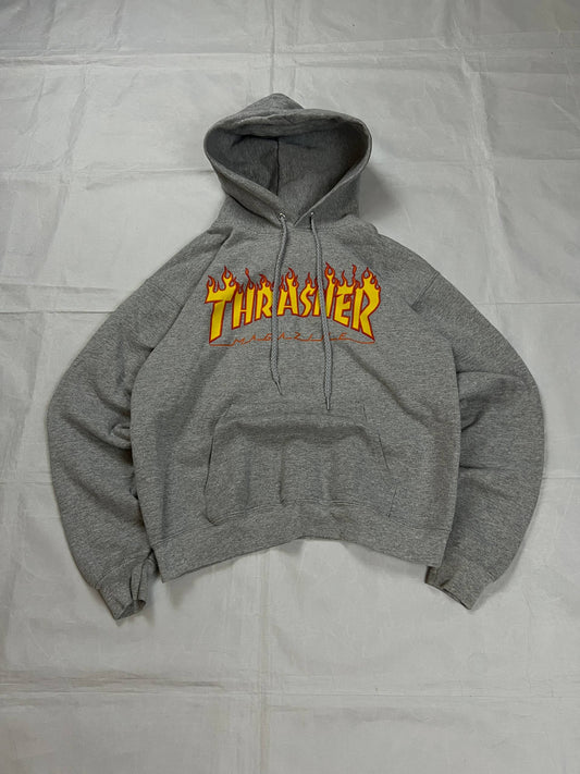Thrasher grey hoodie with yellow and red flaming logo, kangaroo pocket, drawstring hood.