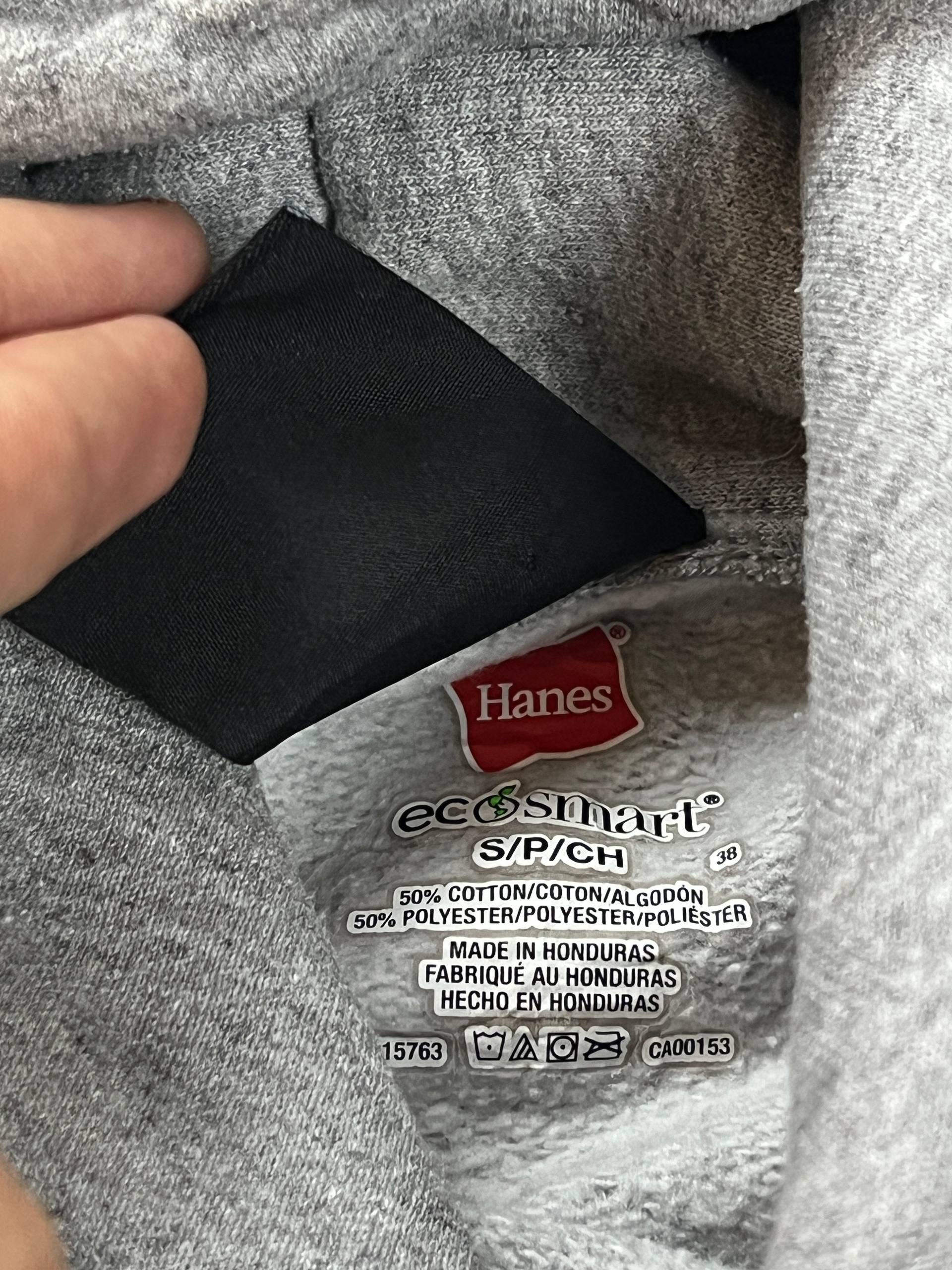 Thrasher grey hoodie with yellow and red flaming logo, kangaroo pocket, drawstring hood.