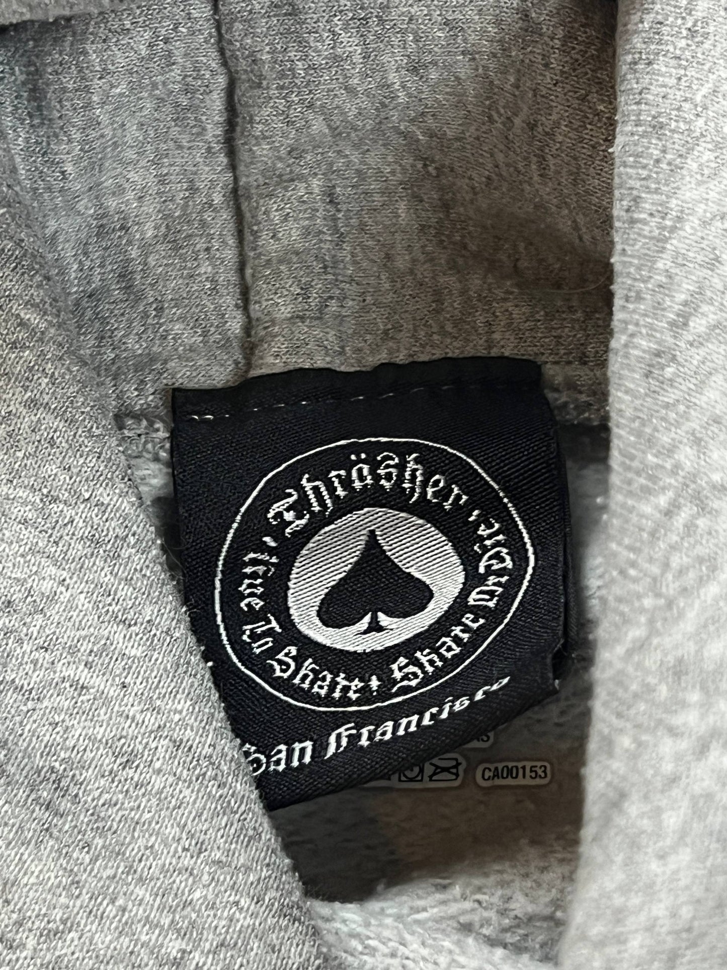 Thrasher grey hoodie with yellow and red flaming logo, kangaroo pocket, drawstring hood.