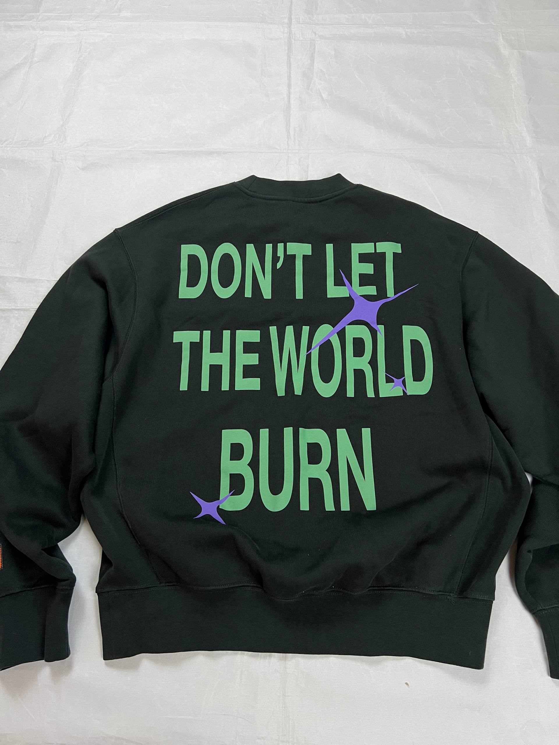 Heron Preston black graphic crewneck sweatshirt with white 'HERON' text and orange label patch.
