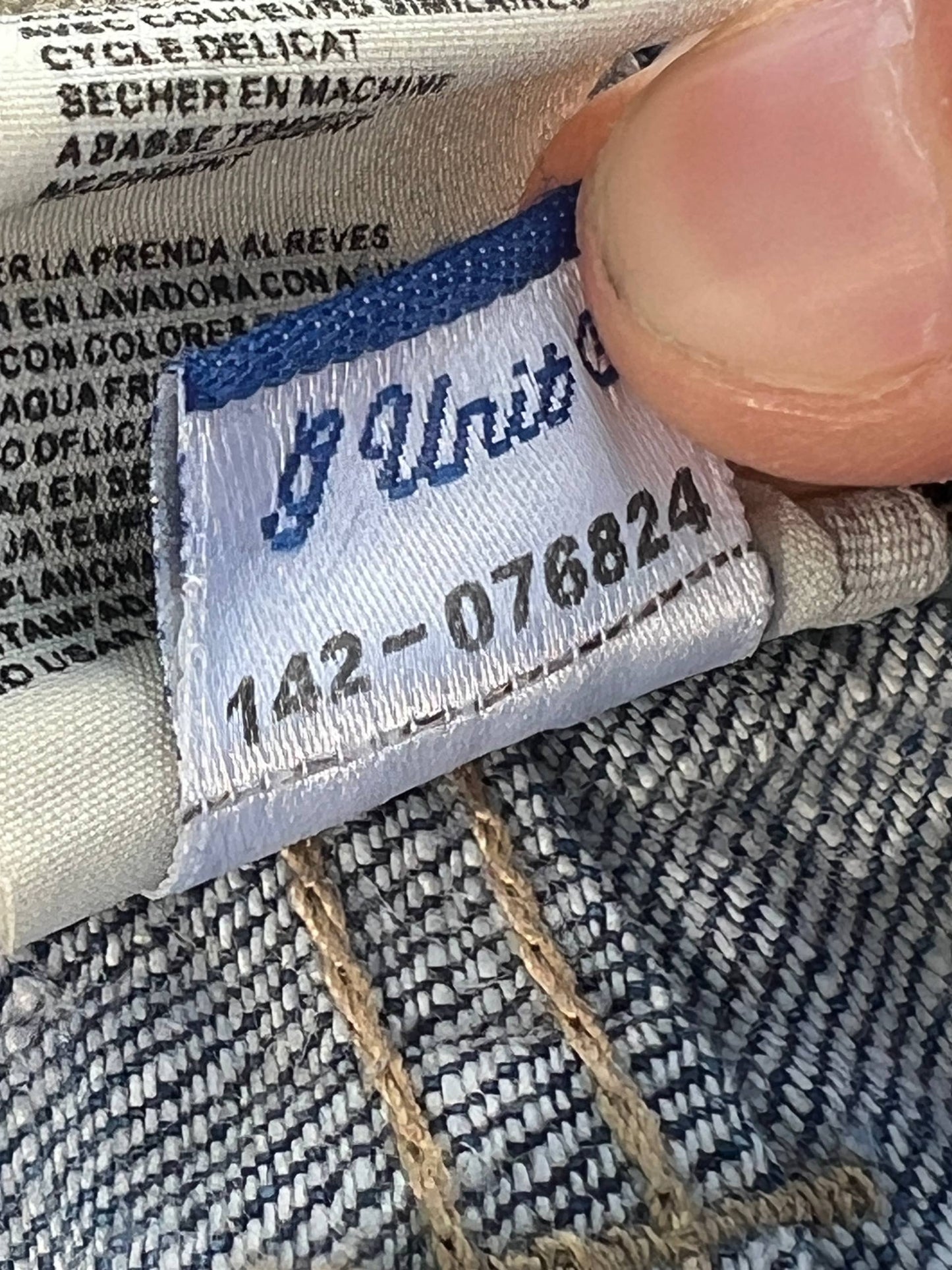 G-Unit light blue denim jeans with unique back pocket designs and leather brand patch.