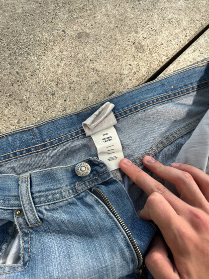 G-Unit light blue denim jeans with unique back pocket designs and leather brand patch.