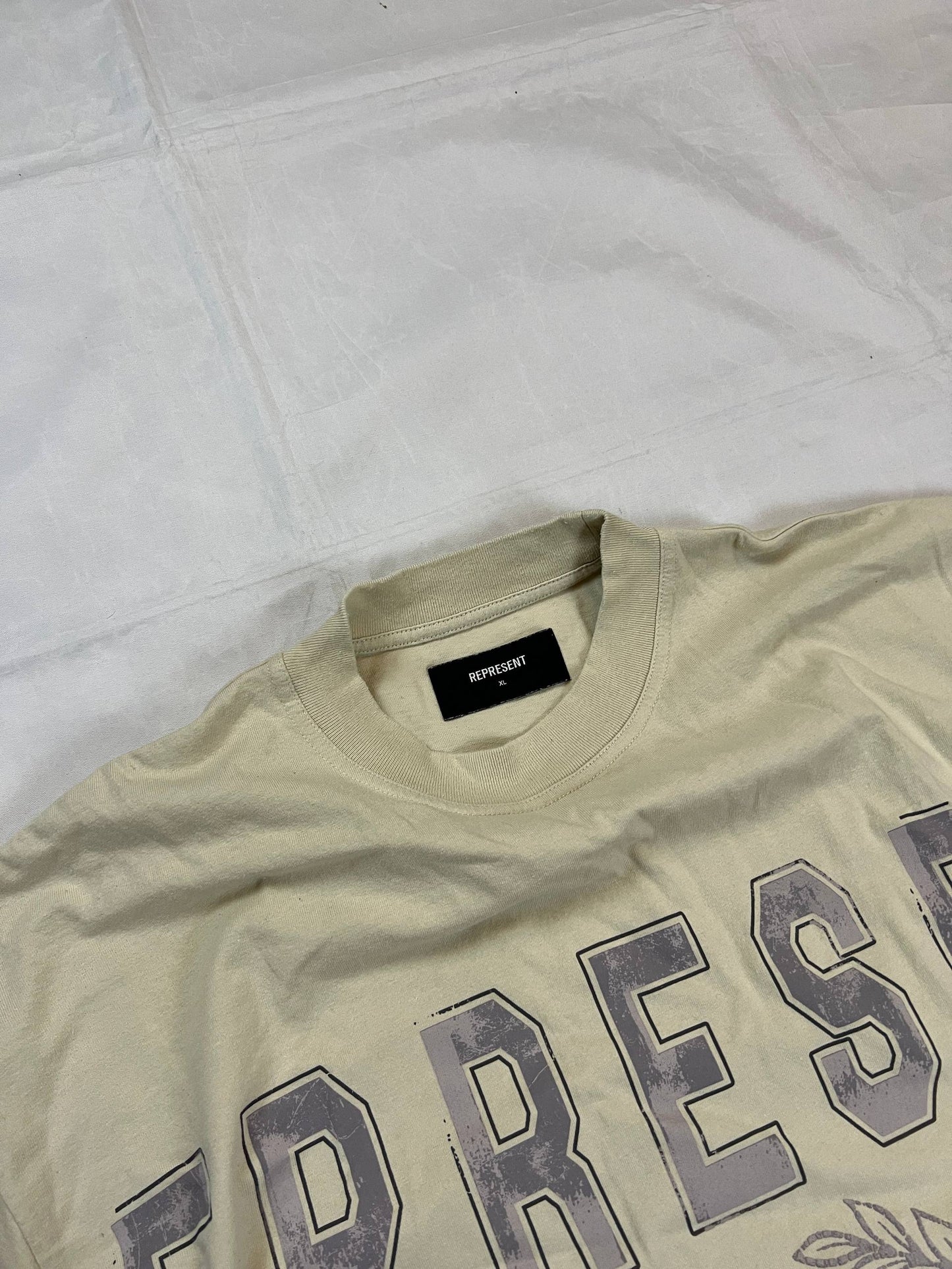 Represent beige cotton T-shirt XL with large 'REPRESENT' print and 'Angels Academy' emblem.