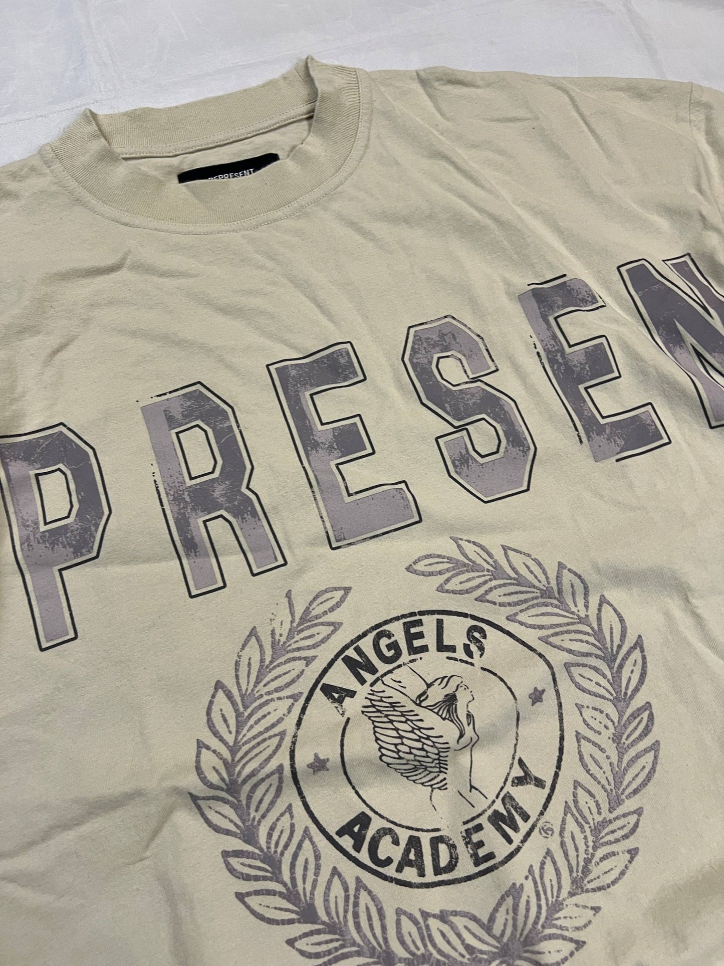 Represent beige cotton T-shirt XL with large 'REPRESENT' print and 'Angels Academy' emblem.