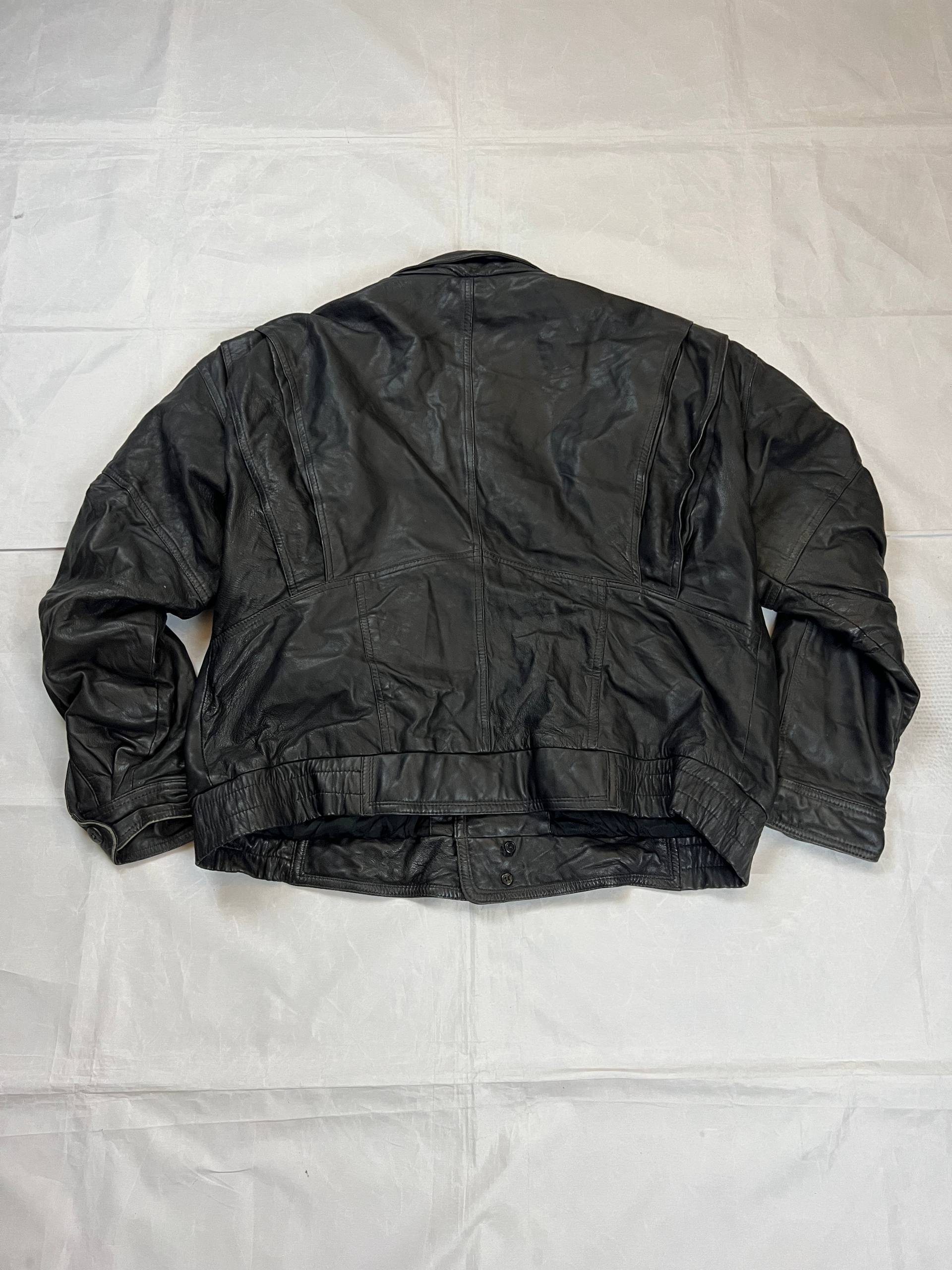 Bomber black leather bomber jacket with flap pockets and patterned lining.