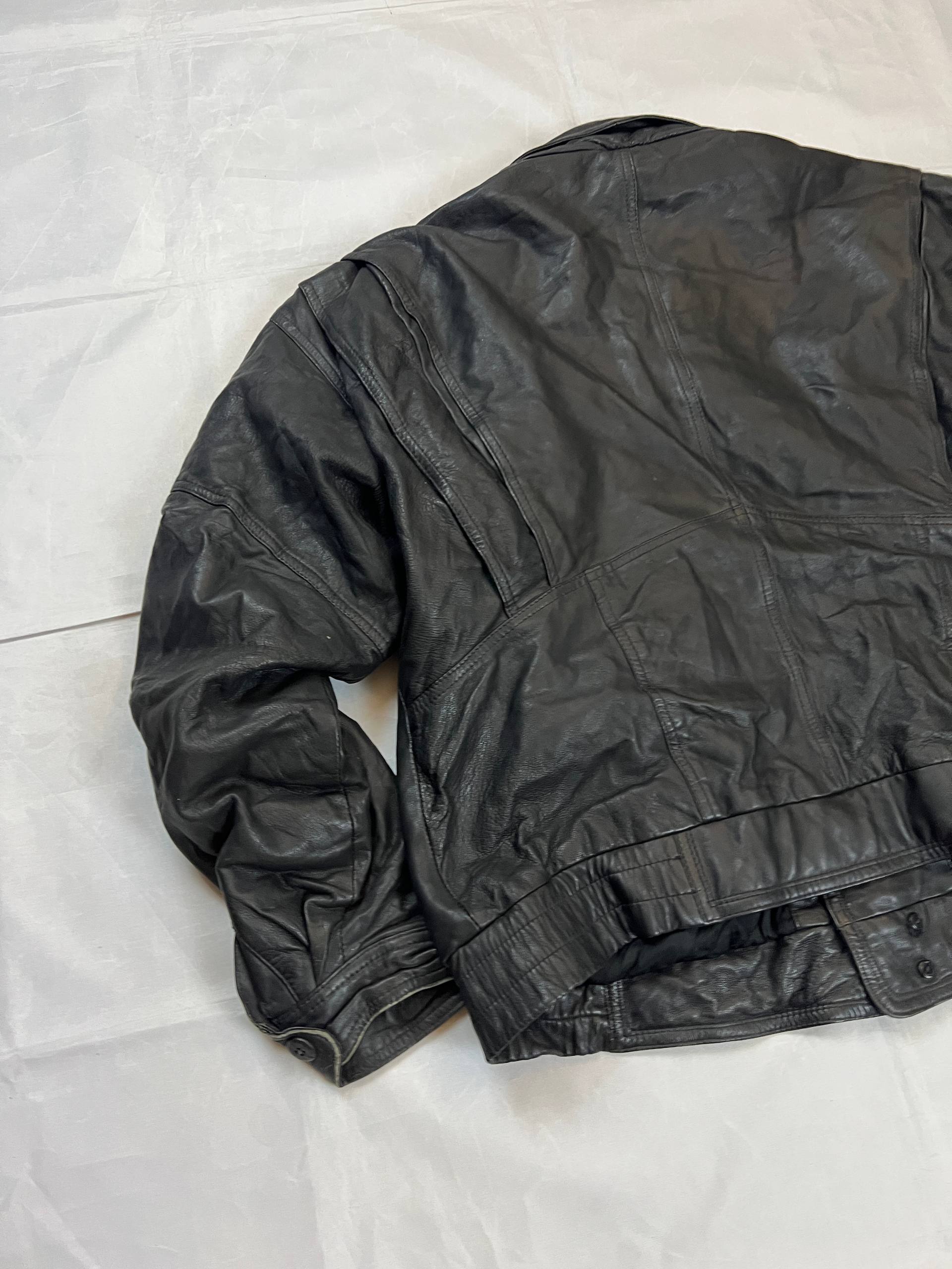 Bomber black leather bomber jacket with flap pockets and patterned lining.