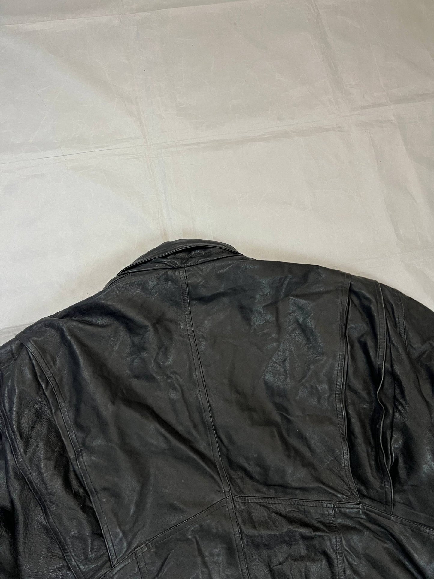 Bomber black leather bomber jacket with flap pockets and patterned lining.