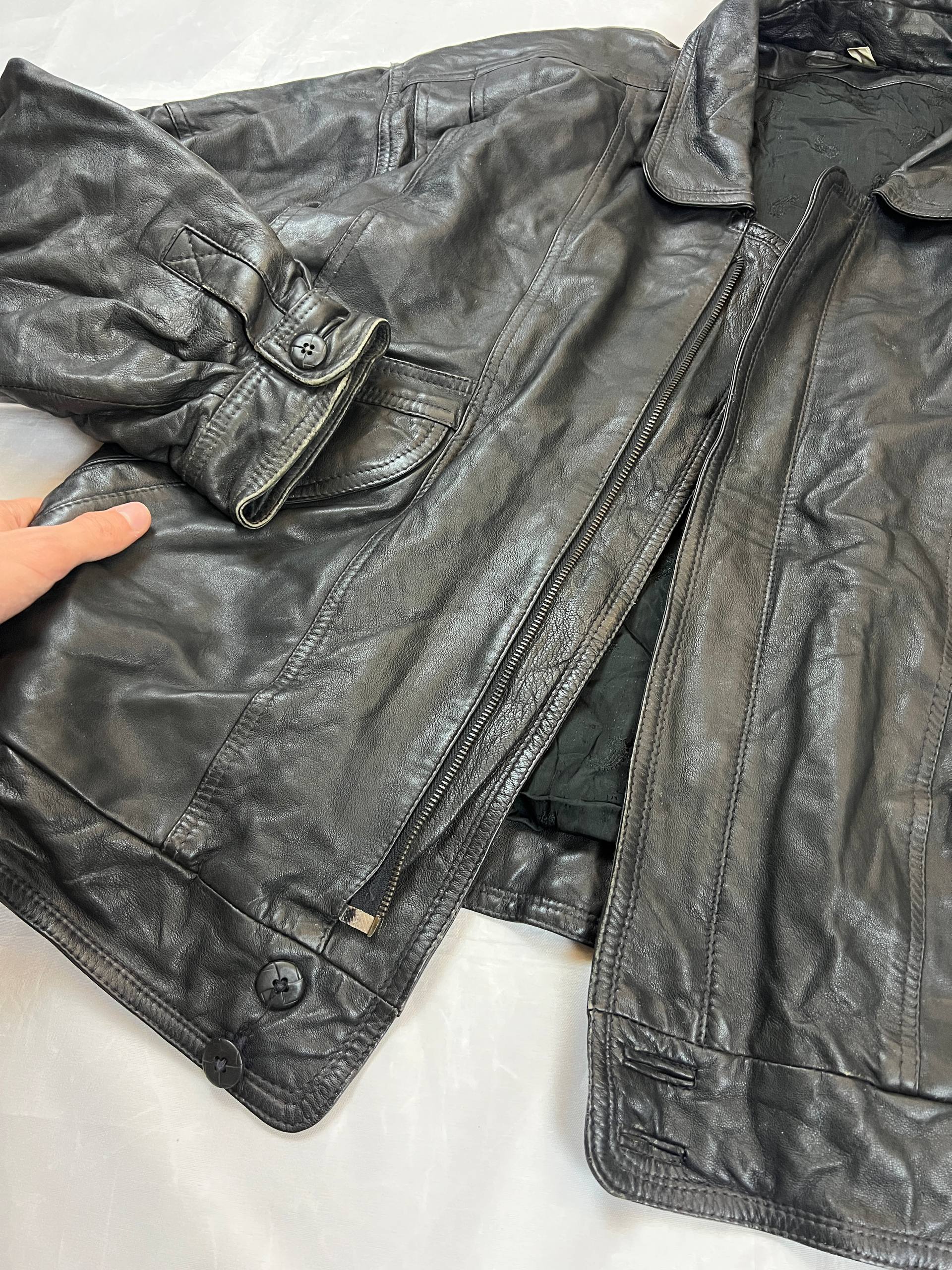 Bomber black leather bomber jacket with flap pockets and patterned lining.