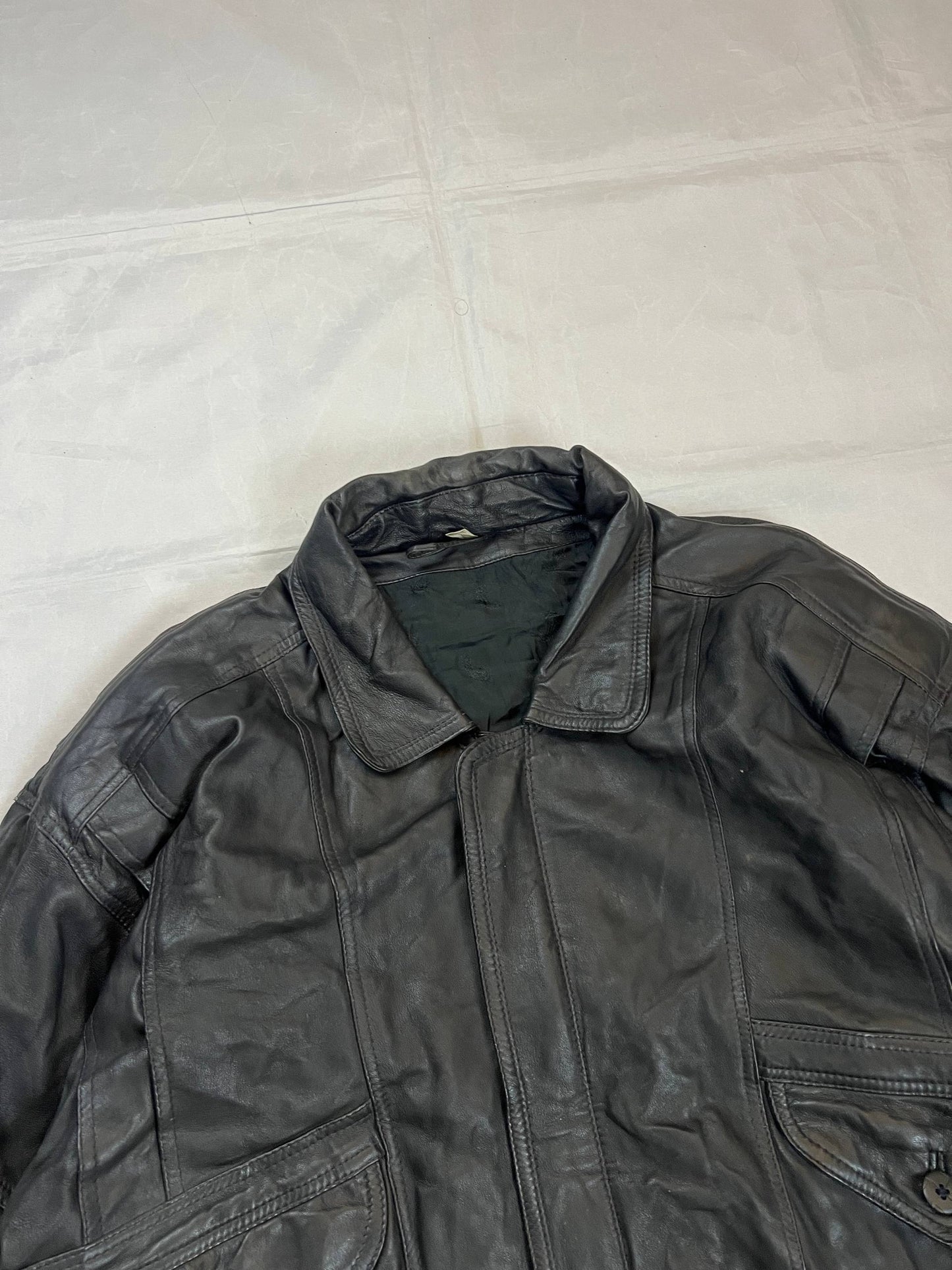 Bomber black leather bomber jacket with flap pockets and patterned lining.