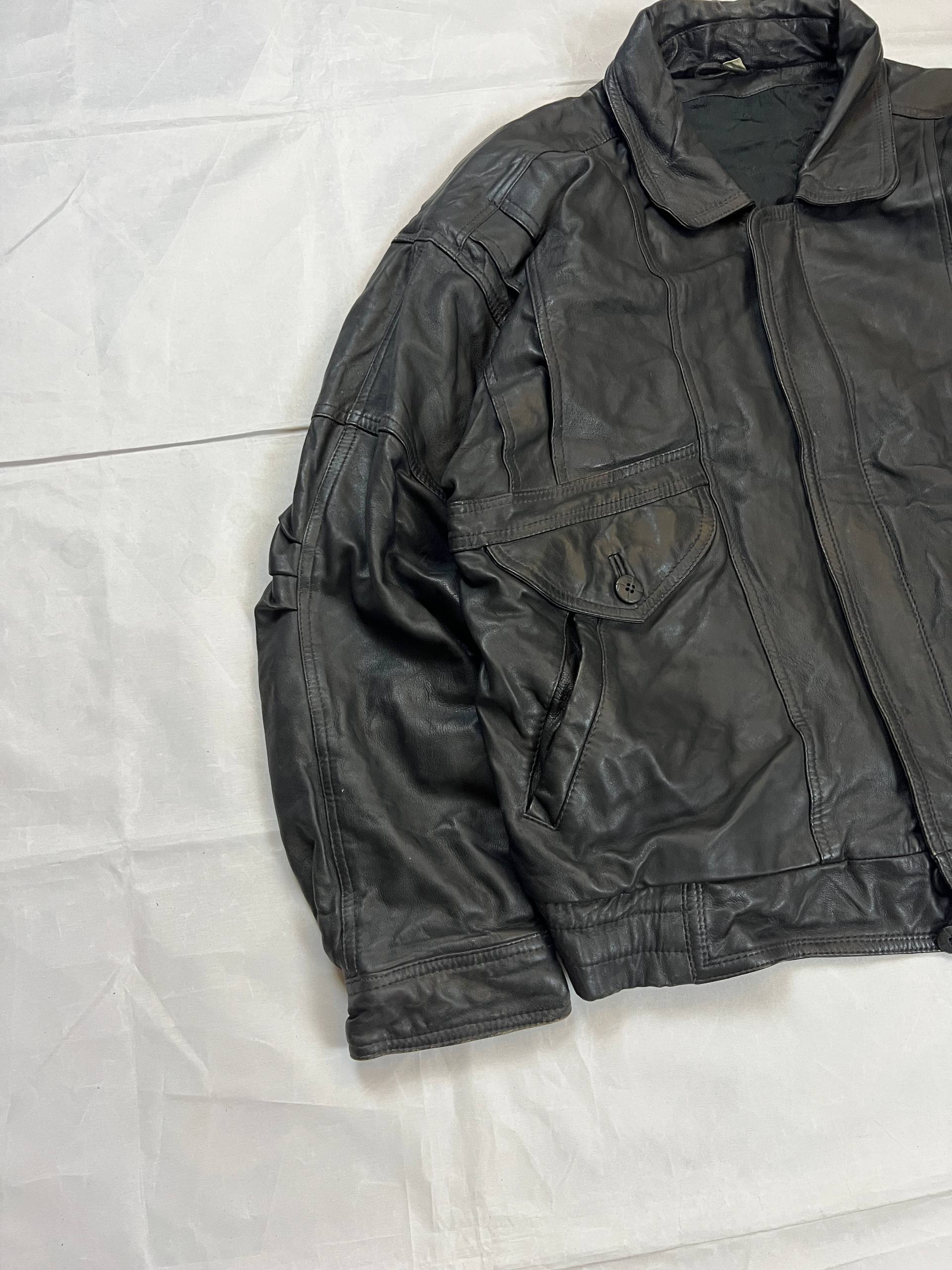Bomber black leather bomber jacket with flap pockets and patterned lining.