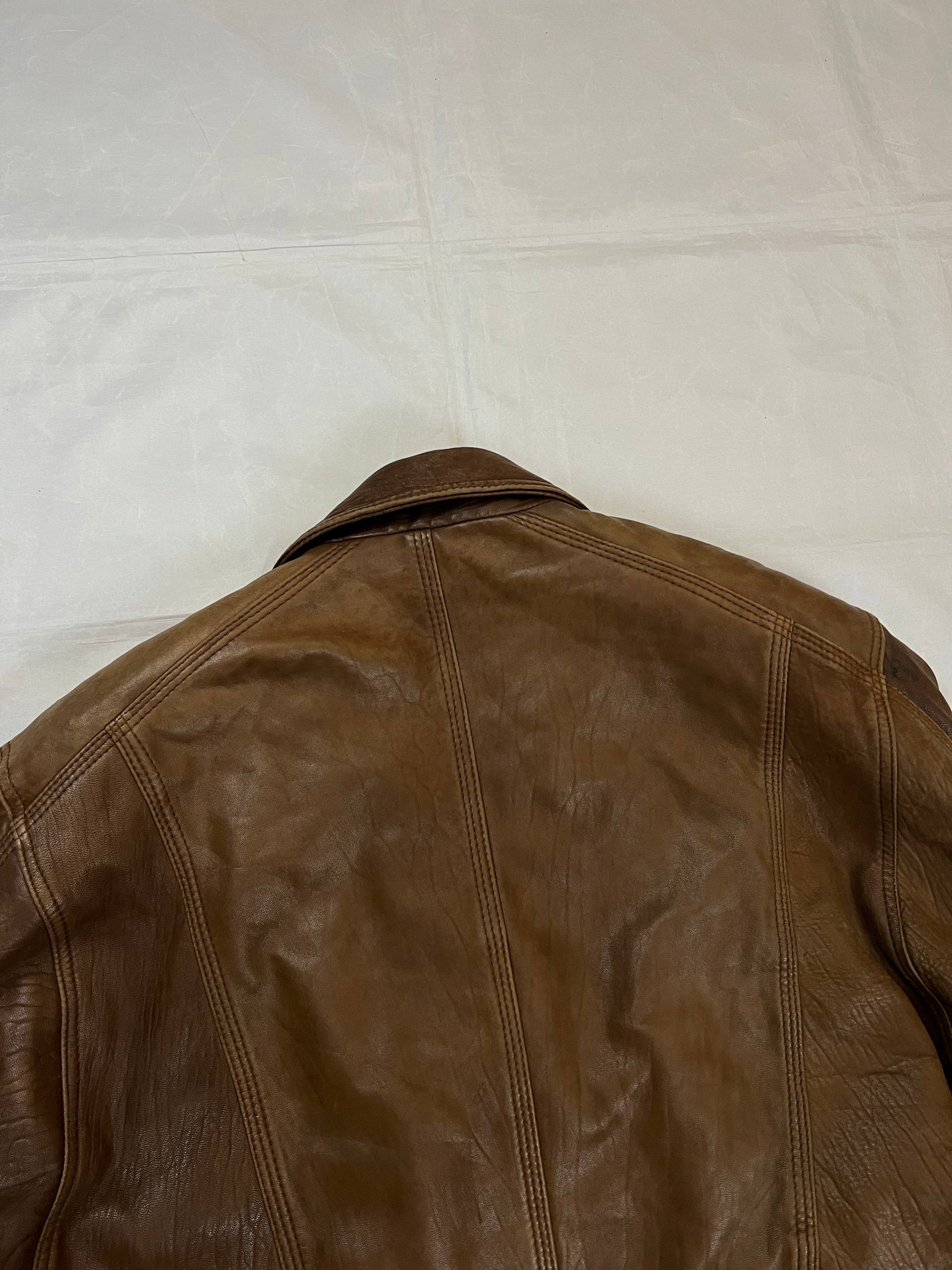 Bomber brown leather men's vintage bomber jacket with elasticized waist and flap pockets.