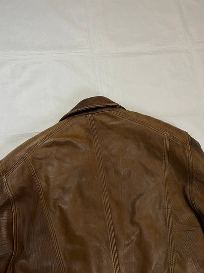 Bomber brown leather men's vintage bomber jacket with elasticized waist and flap pockets.