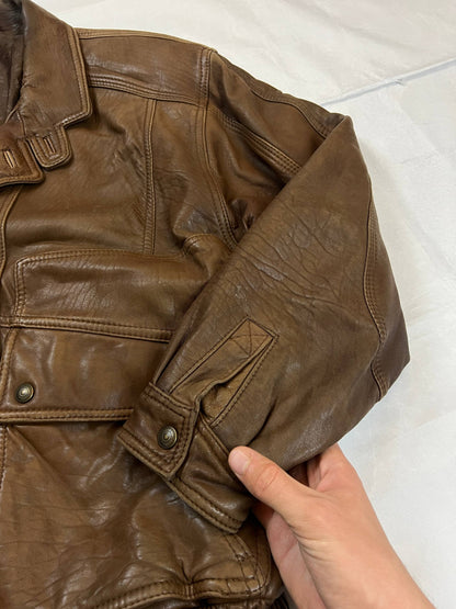 Bomber brown leather men's vintage bomber jacket with elasticized waist and flap pockets.