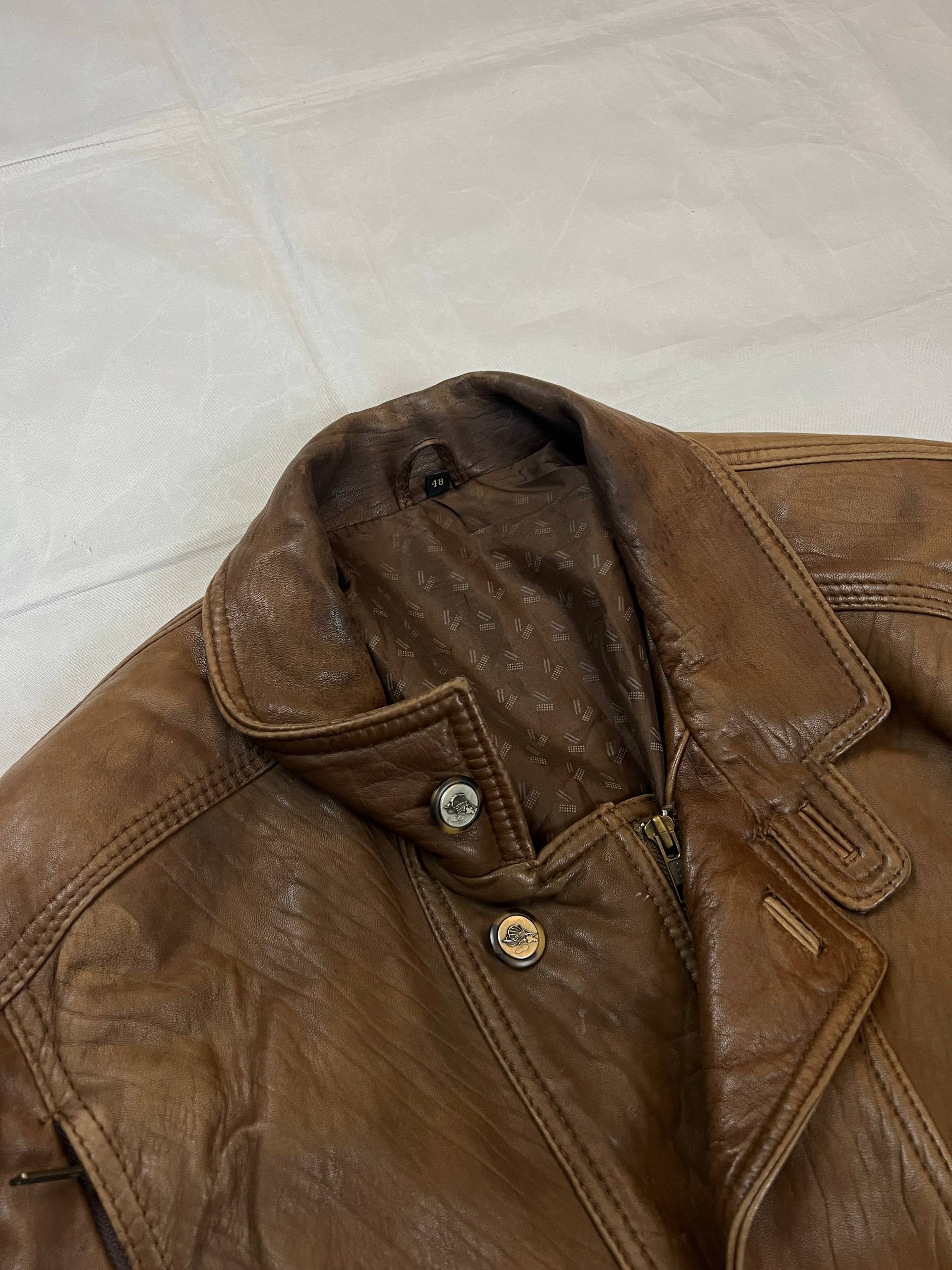 Bomber brown leather men's vintage bomber jacket with elasticized waist and flap pockets.
