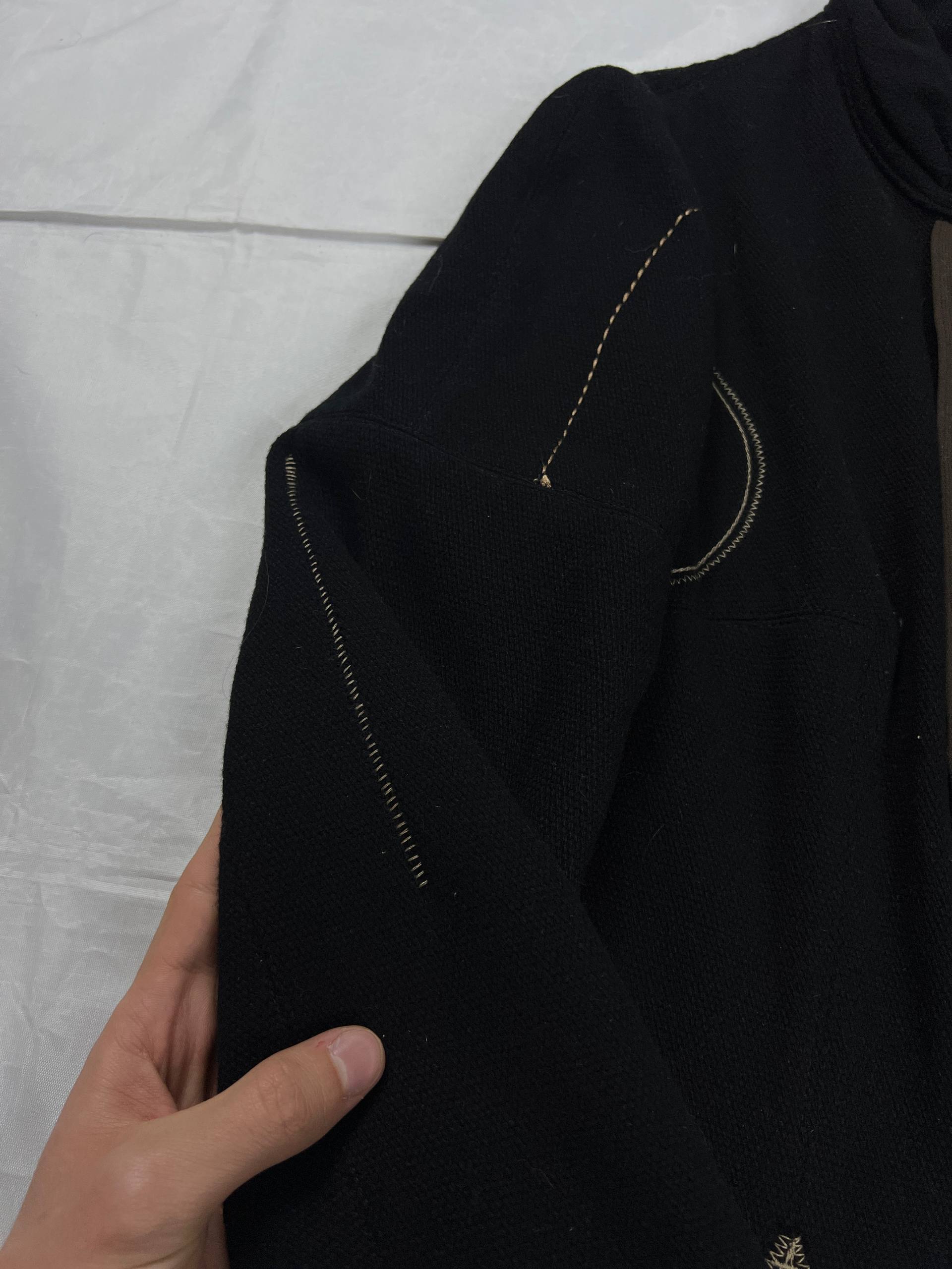 MARITHÉ & FRANÇOIS GIRBAUD black wool jacket unique toggle closure and contrast stitching details.